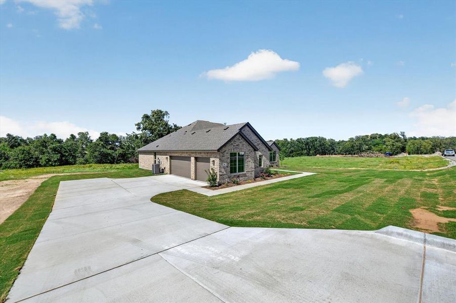 Stone and brick exterior residence with a two-car garage