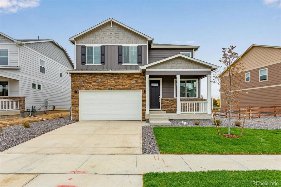 Front exterior of a new home in Hansen Farm, Fort Collins, CO, highlighting curb appeal (Image 19).