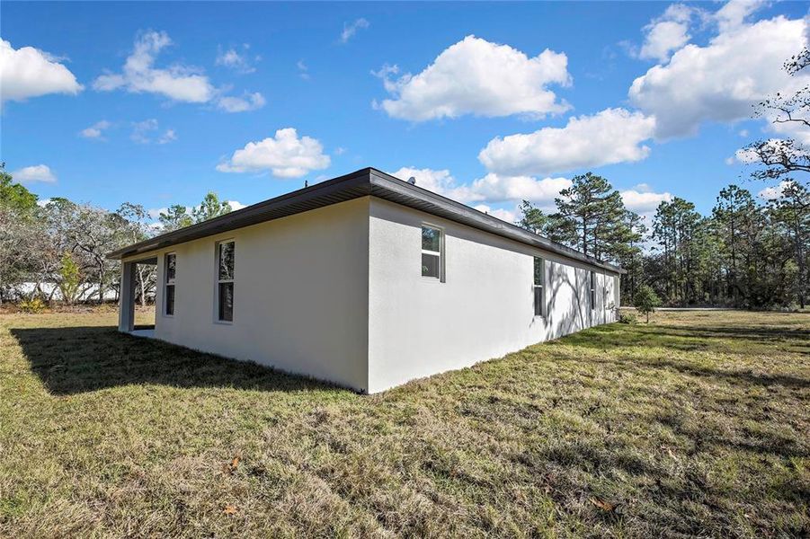 Exterior details and patio area of a home in , Brooksville (Image 28).