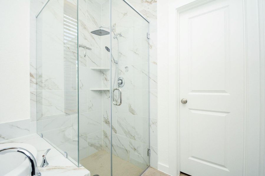 Oversized walk in shower with stylish tile surround. Oversized walk in shower with stylish tile surround.