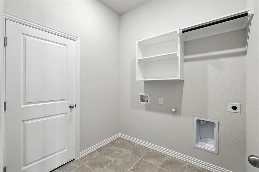 Laundry area with hookup for a gas dryer, hookup for an electric dryer, and washer hookup Laundry area with hookup for a gas dryer, hookup for an electric dryer, and washer hookup