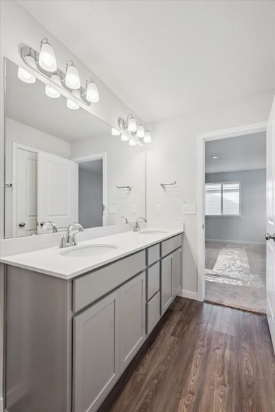 A bathroom with a large mirror.