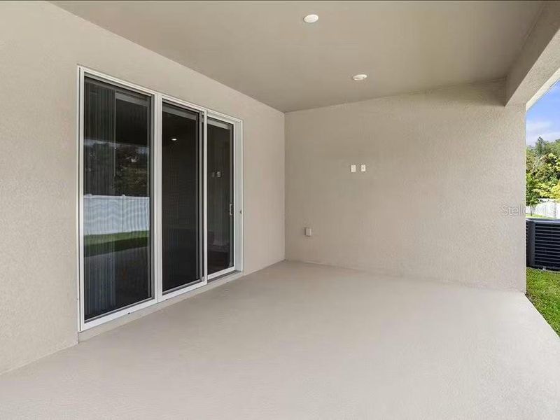 Exterior details and patio area of a home in Falls of Ocala, Ocala (Image 2).