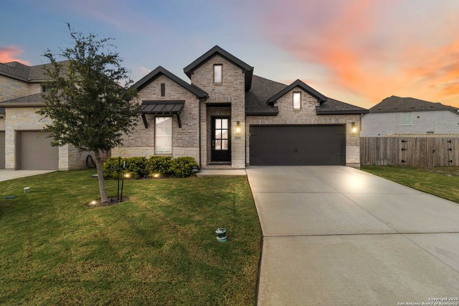 Front exterior of a new home in Alsatian Oaks 50', Castroville, TX, highlighting curb appeal (Image 2). Front exterior of a new home in Alsatian Oaks 50', Castroville, TX, highlighting curb appeal (Image 2).