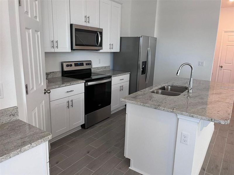Furnished interior view inside a new home in The Meadow at Crossprairie Bungalows, St. Cloud (Image 3).