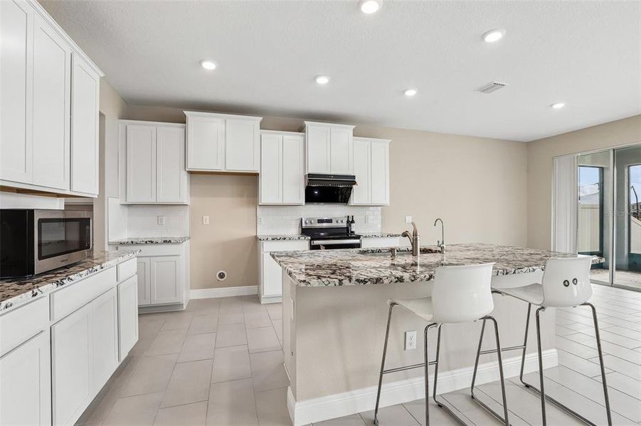 Furnished interior view inside a new home in Mangrove Manor, Apollo Beach (Image 8).