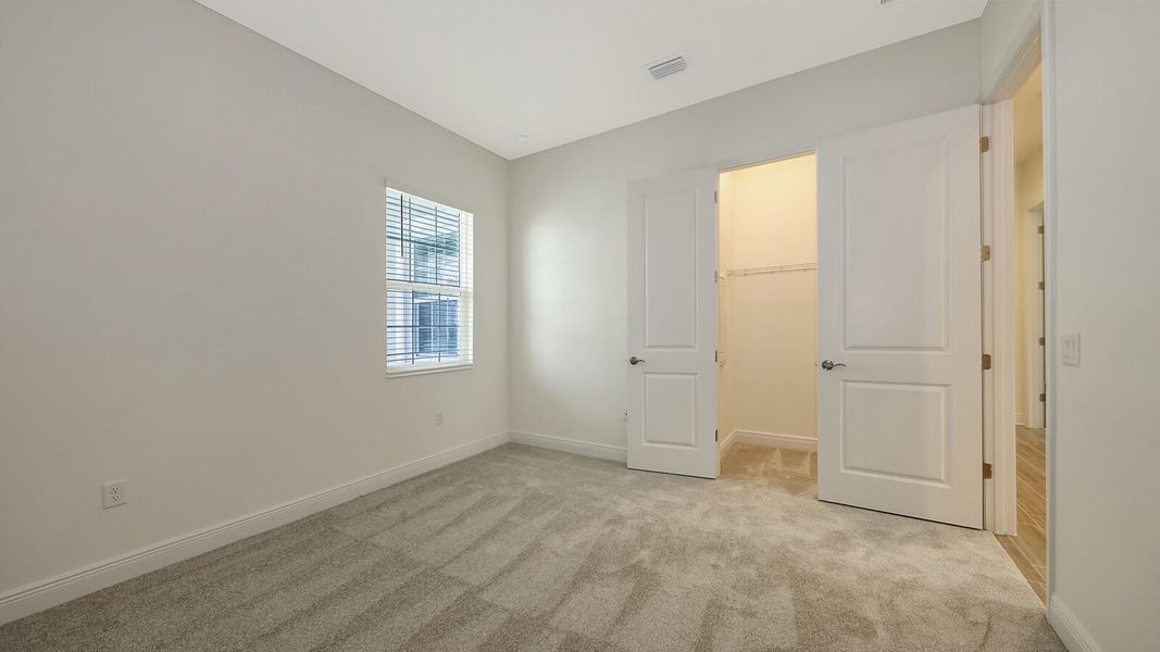 Spacious, unfurnished interior of a new home in Wildleaf at North River Ranch, Parrish (Image 31).