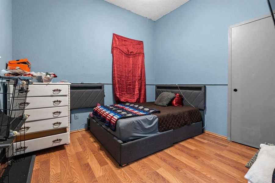 Bedroom with light wood-type flooring