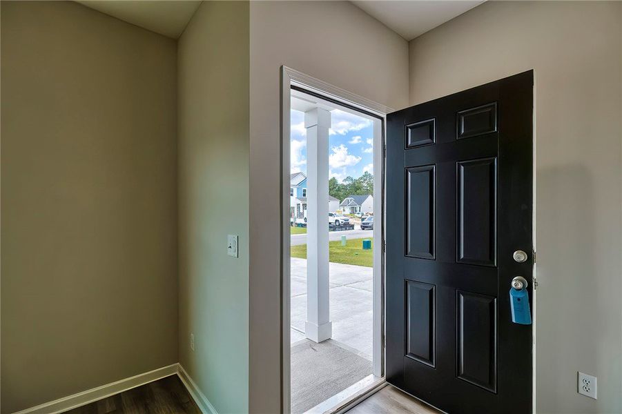 Step inside this inviting entry with wood flooring