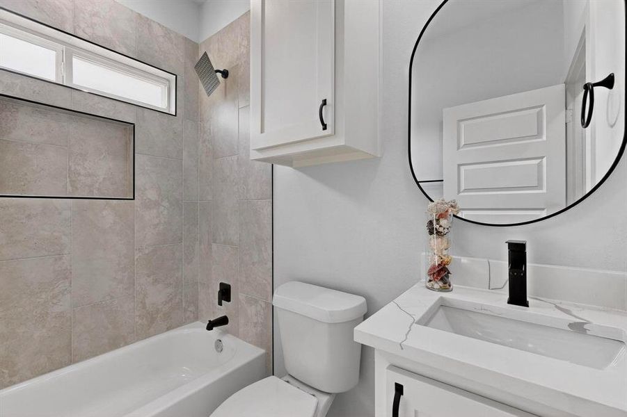 Full bath featuring shower / tub combination and vanity Full bath featuring shower / tub combination and vanity