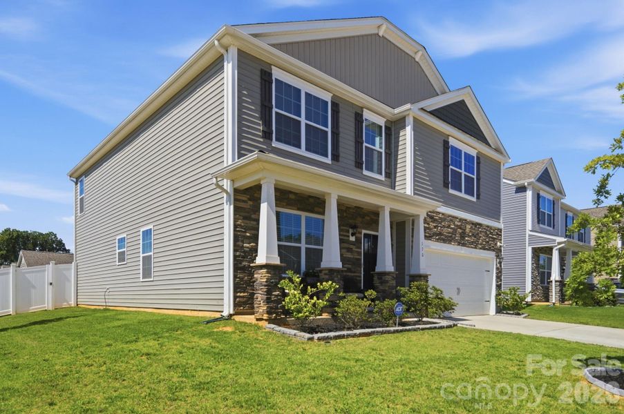 Stone accents and an end-lot setting make this home stand out from the rest. Stone accents and an end-lot setting make this home stand out from the rest.