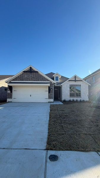 Front exterior of a new home in Liberty Pointe, Gainesville, TX, highlighting curb appeal (Image 2). Front exterior of a new home in Liberty Pointe, Gainesville, TX, highlighting curb appeal (Image 2).