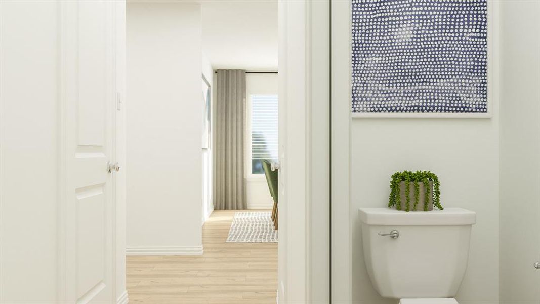 Bathroom featuring toilet and hardwood / wood-style floors