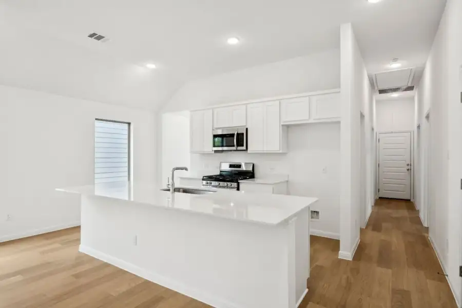 Kitchen in the Spruce home plan by Trophy Signature Homes - REPRESENTATIVE PHOTO