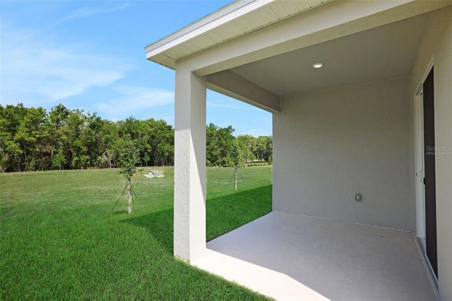 Exterior details and patio area of a home in Seaport Village, Tavares (Image 3).