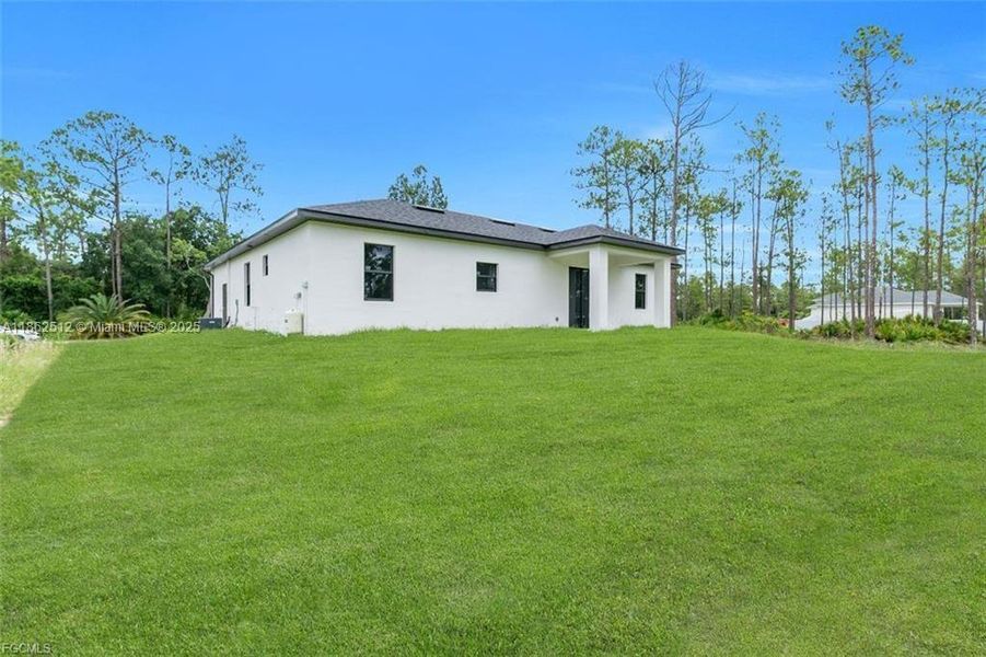 Front exterior of a new home in , Lehigh Acres, FL, highlighting curb appeal (Image 2).