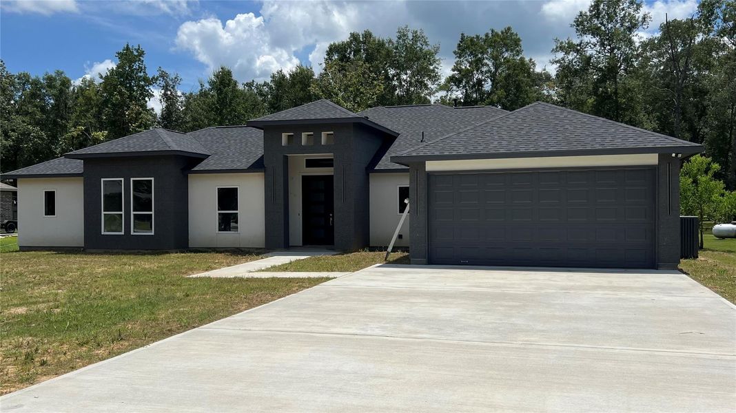 Front exterior of a new home in , Dayton, TX, highlighting curb appeal (Image 2). Front exterior of a new home in , Dayton, TX, highlighting curb appeal (Image 2).