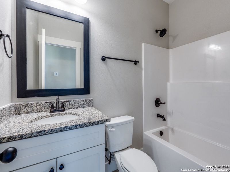 Furnished interior view inside a new home in Las Palomas Country Club Estates, La Vernia (Image 6).