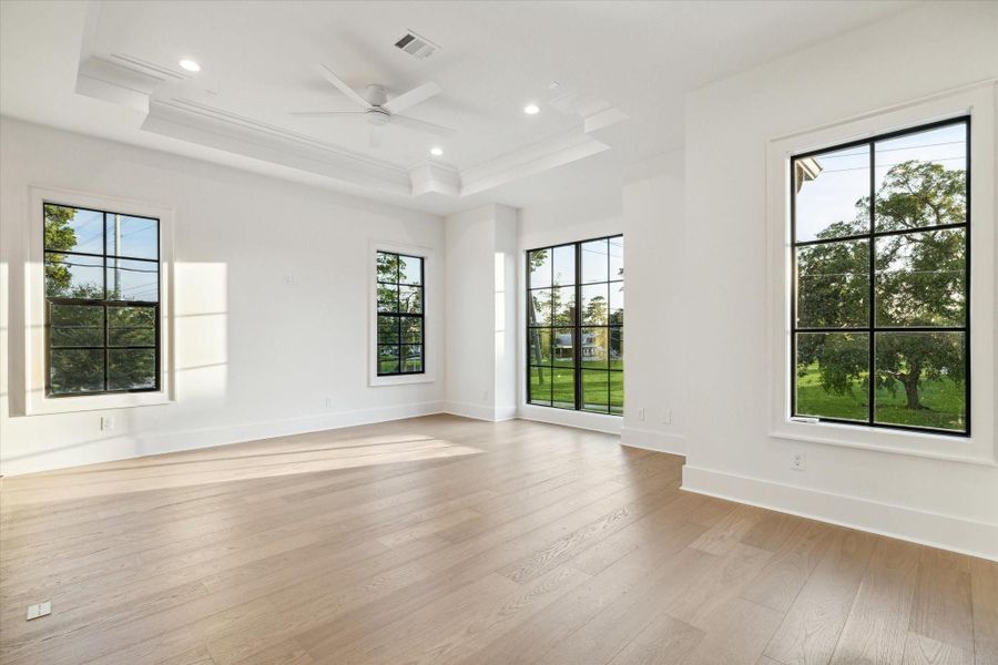 Large game room with tons of natural light and insane ceiling trim + molding*Picture is of a recently constructed home by the builder.  1519 Candlelight will be similar in quality, but these pictures are not meant to be an exact representation of the new home. Specs of home may change at sole discretion of the seller.