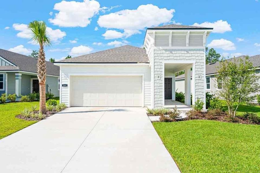 Front exterior of a new home in Palm Series at Seminole Palms, Palm Coast, FL, highlighting curb appeal (Image 2).