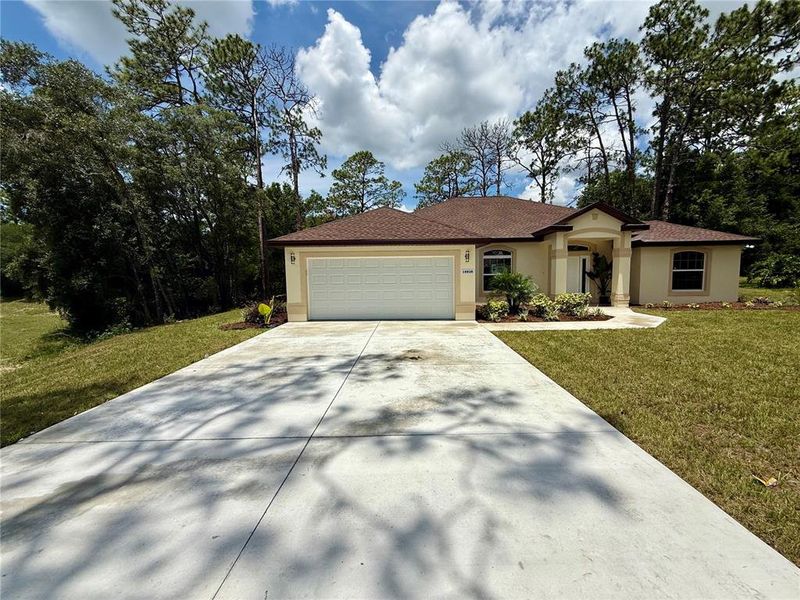 Front exterior of a new home in , Dunnellon, FL, highlighting curb appeal (Image 28).