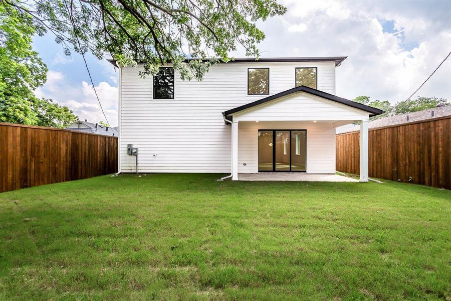 Rear view of property with a patio area