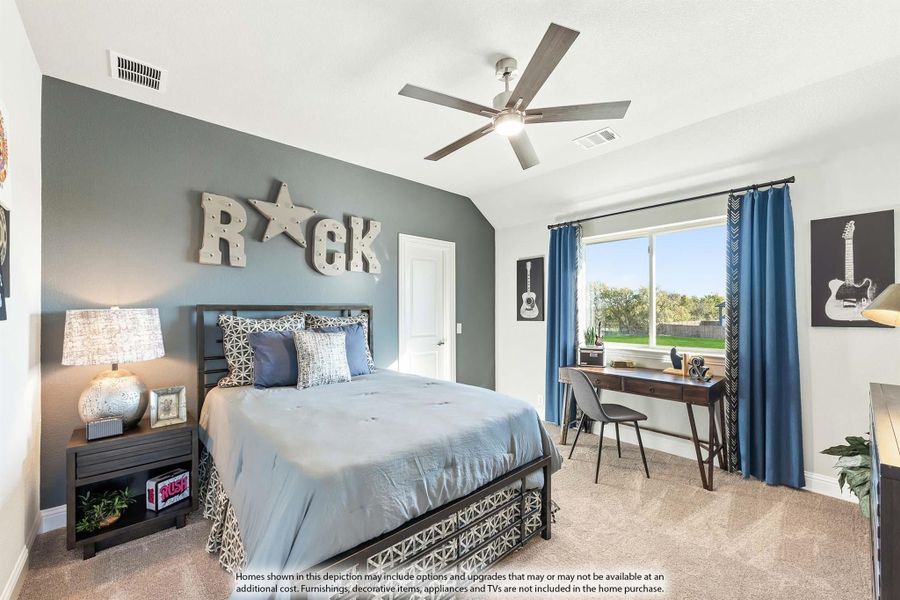 Bedroom with gray accent wall, ceiling fan, carpet, and desk near window with blue curtains