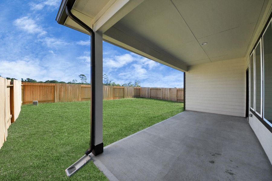 Experience outdoor living at its finest on this expansive covered patio, thoughtfully designed for BBQs and delightful outdoor dining.