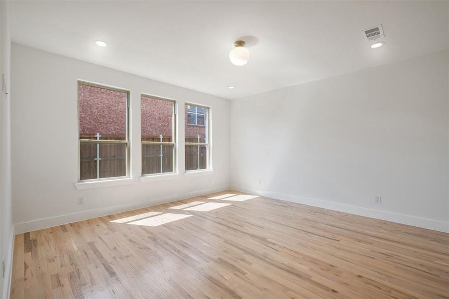 Spare room featuring light wood-style floors and recessed lighting