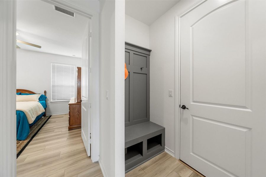 Coming in from the over-sized garage is the mud area, a place to put your coats, shoes and bag. The garage is plumbed for a water softener and has extra space for refrigerator, work bench, plus storage.