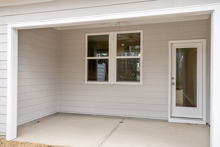 Exterior details and patio area of a home in Ovation at Sweetbrier, Durham (Image 3).