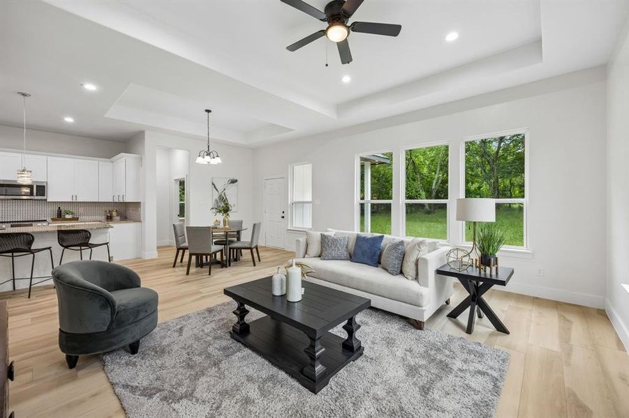 In this view of the open concept living space you can see the backyard.