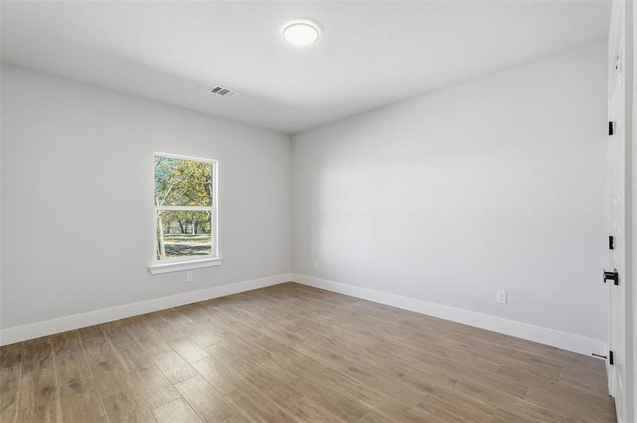 Empty room featuring light wood-style flooring