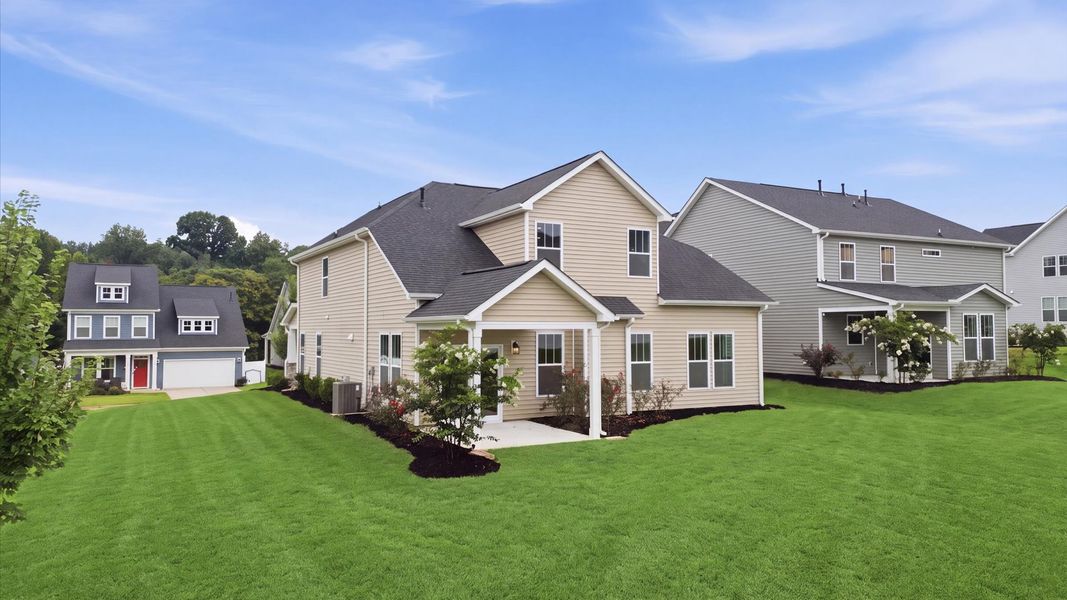 Exclusive rear covered porch with accomplished detail and elevated outdoor living potential at the Fox Hollow community