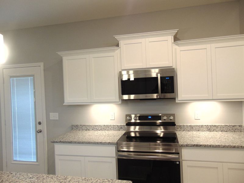 The cabinets are a modern crown design