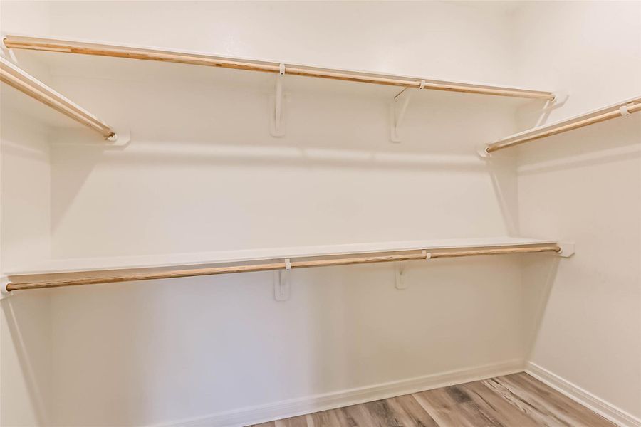 The primary walk-in closet offers ample space for all your belongings. The primary walk-in closet offers ample space for all your belongings.