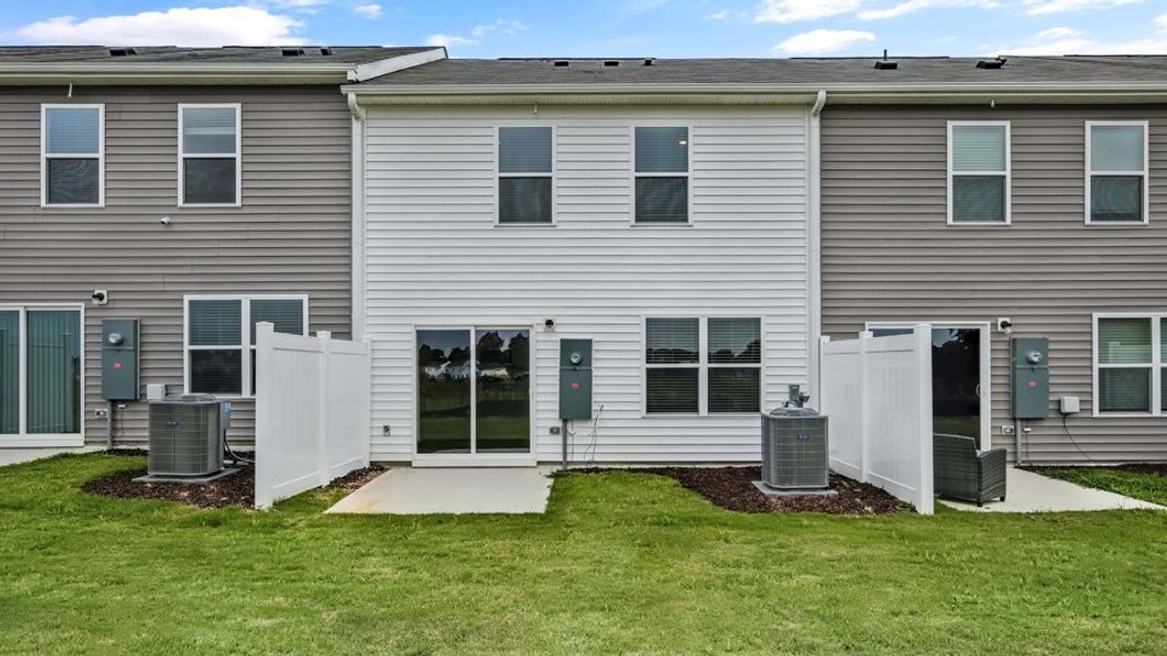 Exterior details and patio area of a home in The Townes at Honeycutt Oaks, Angier (Image 16).