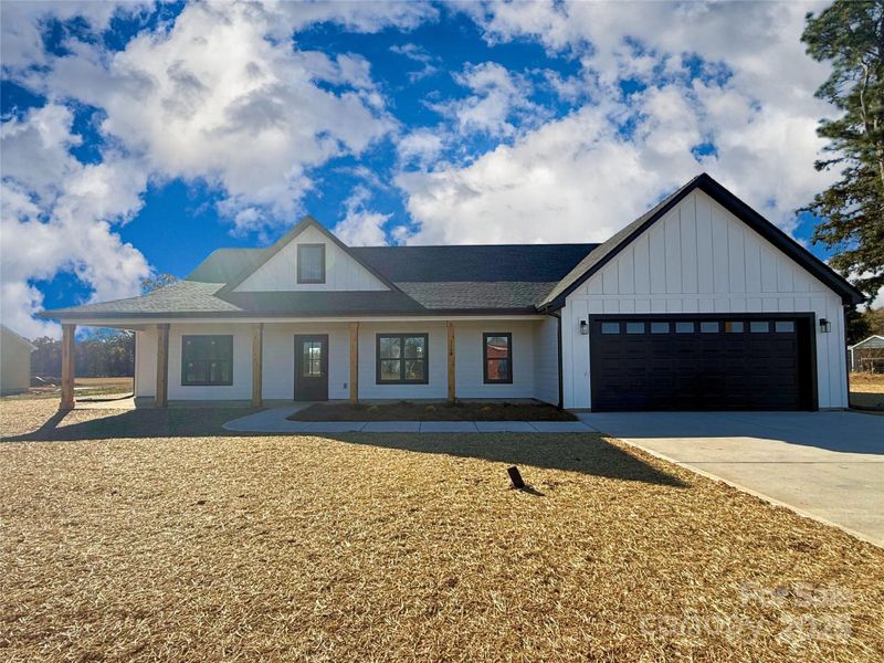 Front exterior of a new home in , Crouse, NC, highlighting curb appeal (Image 2).