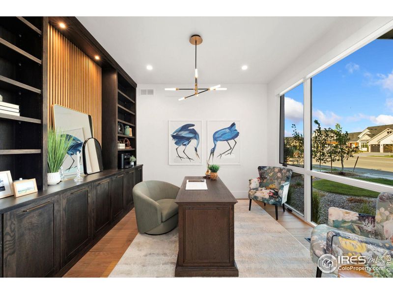 Office with Built in Lighted Shelving and Views to the Front Gardens