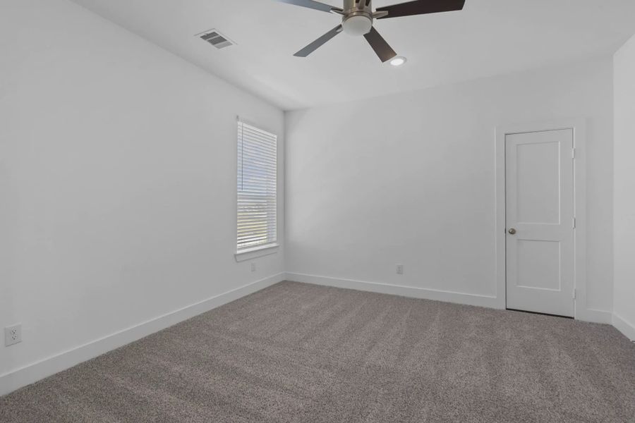 Representative unfurnished interior of a home built from the Waterford by Chesmar Homes in Meridiana 60's, Manvel (Image 44).