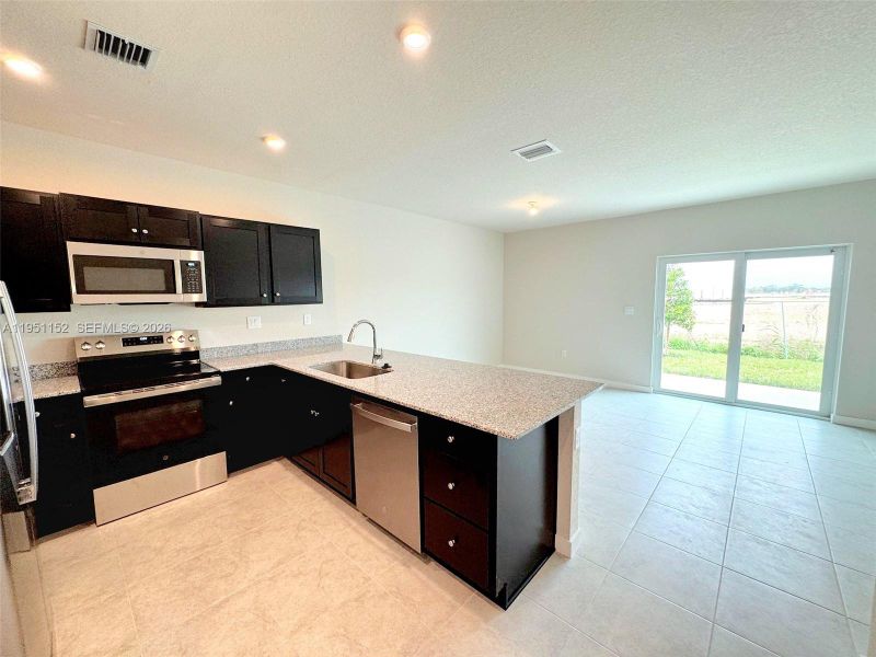 Furnished interior view inside a new home in , Florida City (Image 6). Furnished interior view inside a new home in , Florida City (Image 6).