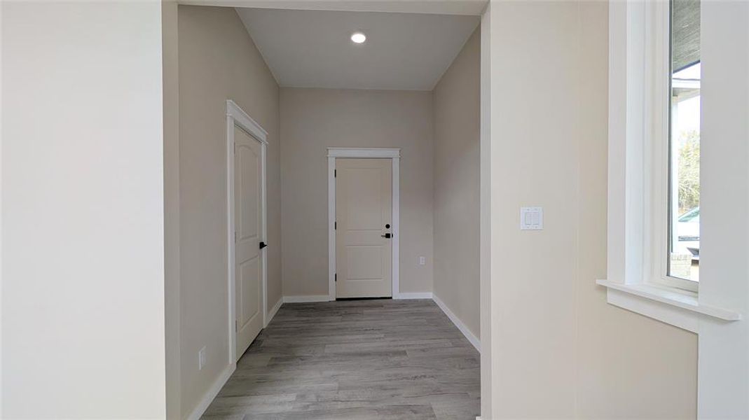 entrance to half bath and garage entrance to half bath and garage
