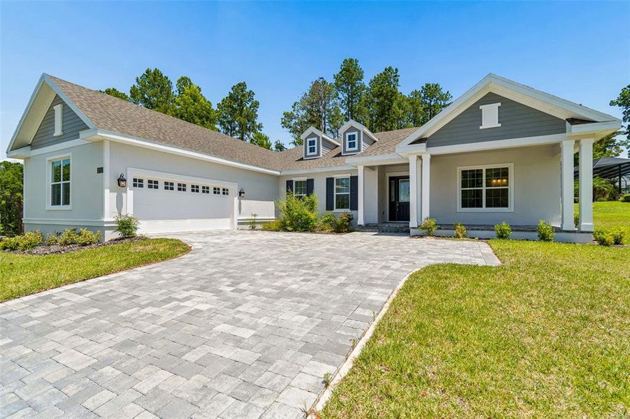 Front exterior of a new home in Southern Hills Plantation, Brooksville, FL, highlighting curb appeal (Image 27). Front exterior of a new home in Southern Hills Plantation, Brooksville, FL, highlighting curb appeal (Image 27).