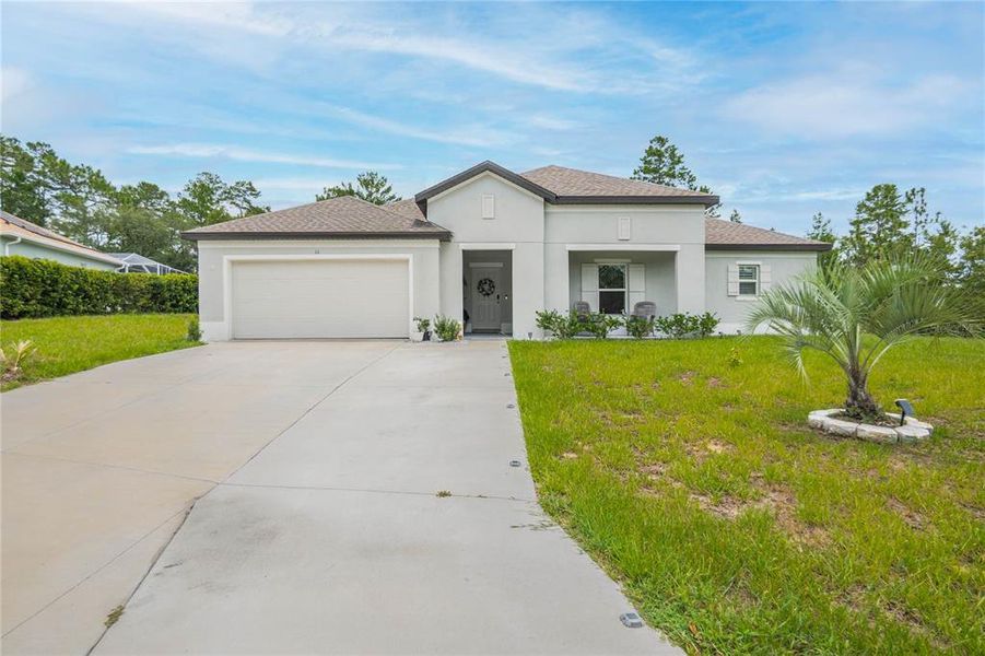 Front exterior of a new home in , Homosassa, FL, highlighting curb appeal (Image 21). Front exterior of a new home in , Homosassa, FL, highlighting curb appeal (Image 21).