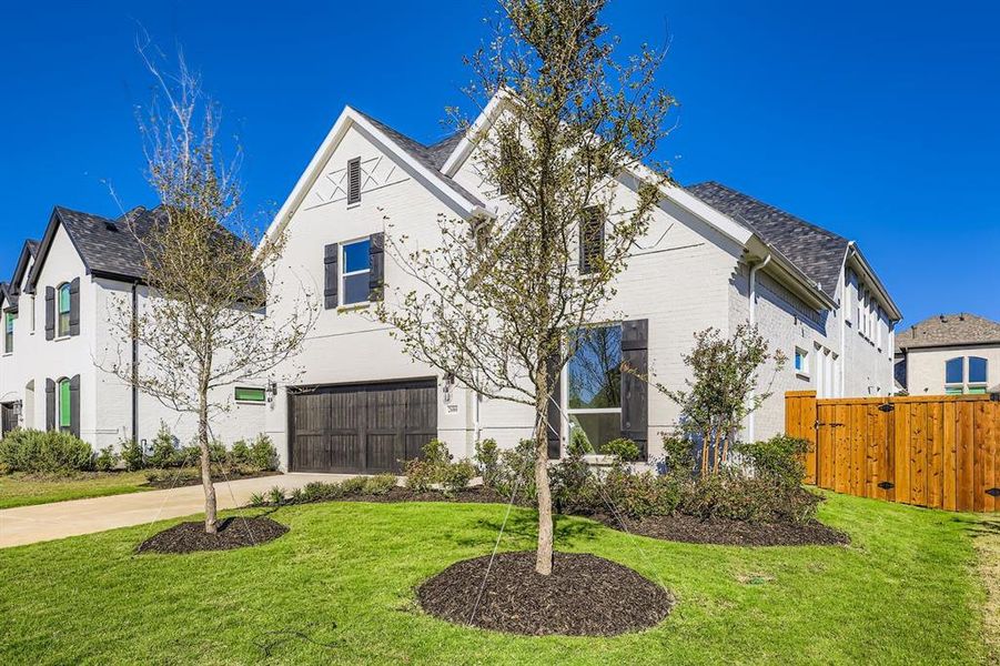 View of front of home featuring concrete driveway, a garage, and brick siding View of front of home featuring concrete driveway, a garage, and brick siding