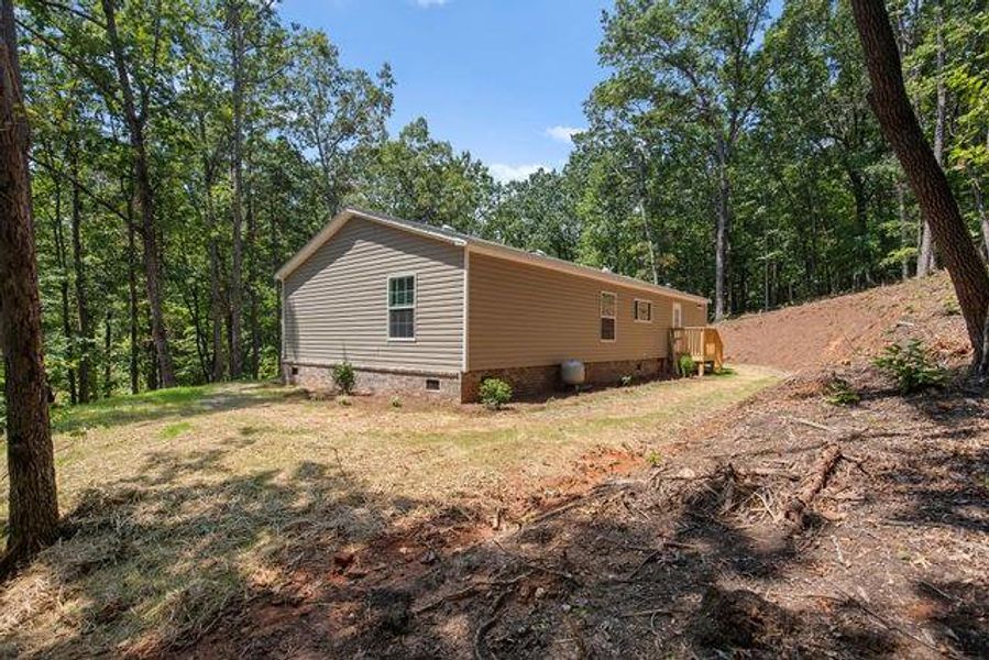 Exterior details and patio area of a home in , Clarkesville (Image 23).