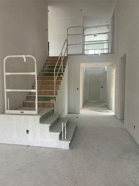 Entry Foyer with soaring ceiling and grand staircase