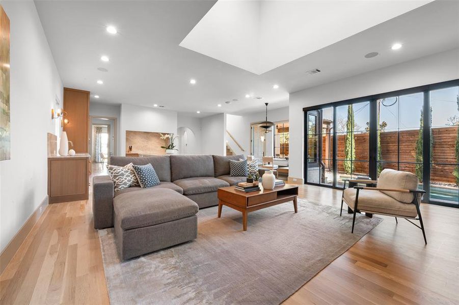 Living room featuring light wood-style floors and recessed lighting