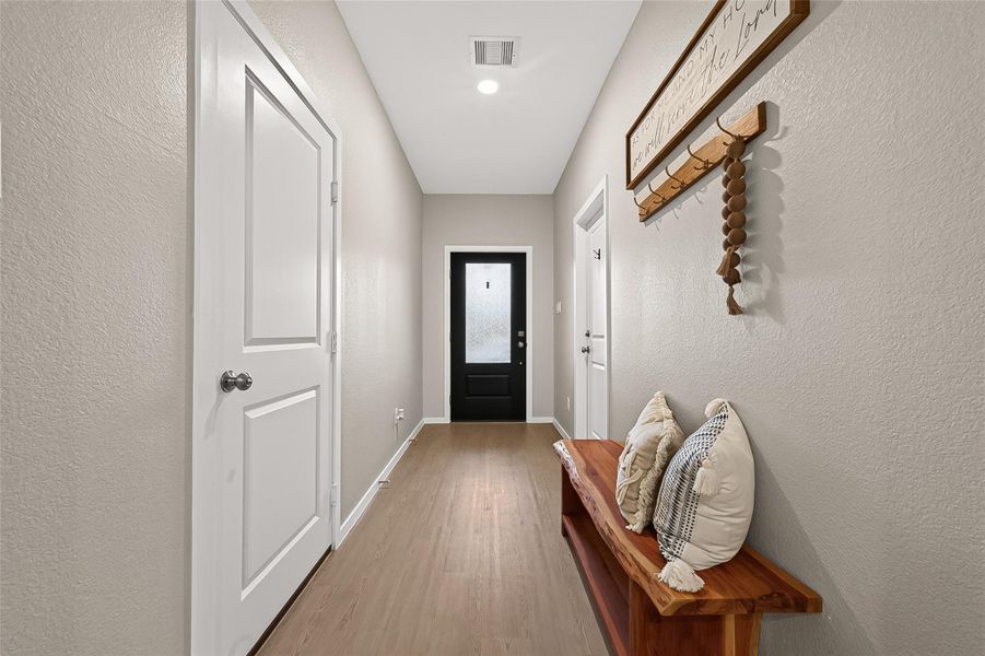 Bright and welcoming entry hallway with clean, modern finishes. Bright and welcoming entry hallway with clean, modern finishes.