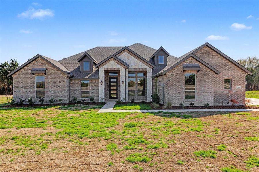 Front exterior of a new home in , Midlothian, TX, highlighting curb appeal (Image 2). Front exterior of a new home in , Midlothian, TX, highlighting curb appeal (Image 2).